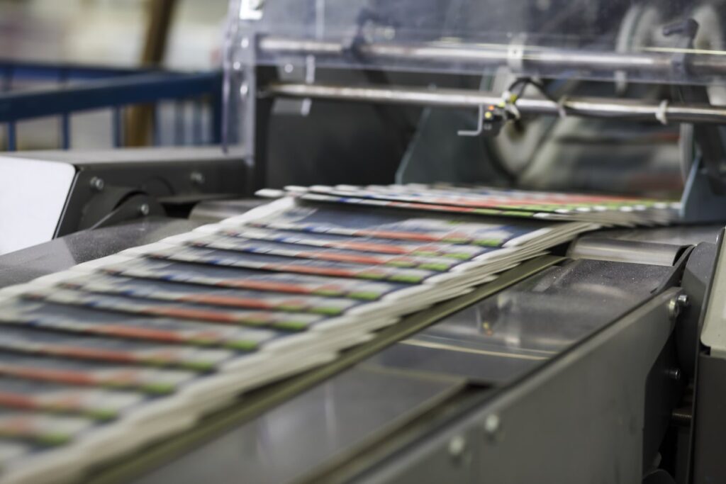 printing press printing stack of booklets